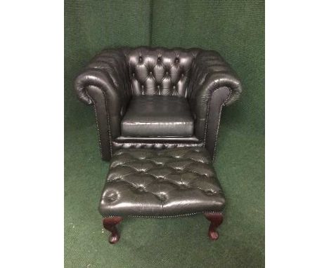 A green button leather Chesterfield armchair and matching footstool 