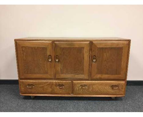 An Ercol elm sideboard