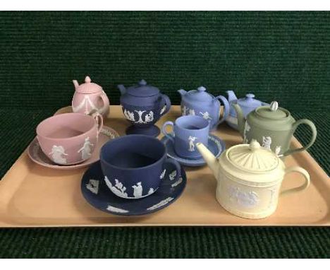 A tray of twelve pieces of Wedgwood jasper ware - Teapots, cups and saucers in various colours