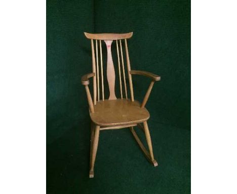 An Ercol elm rocking chair