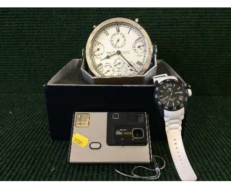 A boxed Wempe contemporary alarm clock together with an Marea wrist watch and Kodak disc 4000 camera