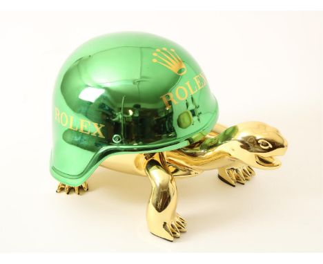 Diederik van Apple (1985-)'Golden Peace Turtle', polystone goud gespotenschildpad met een helmals schild met Rolex-logo,onder