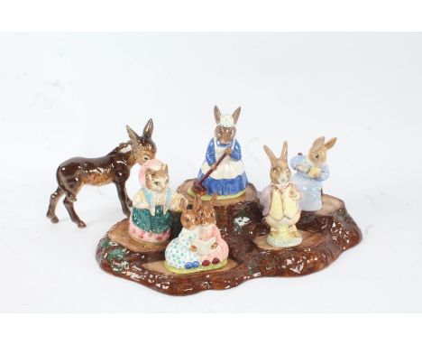 Beswick pottery Tree Stump stand, together with three Beswick and two Royal Doulton Beatrix Potter figures, and a Goebel donk