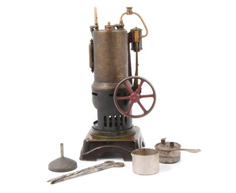 A Gebruder Bing live steam vertical steam engine model, height 25cm, with a selection of accessories.