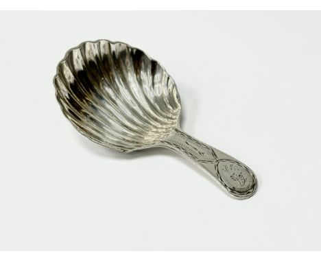 A George III silver tea caddy spoon. Possibly 1803.