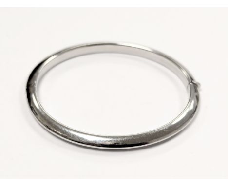 A 9ct white gold bangle. 9.2g