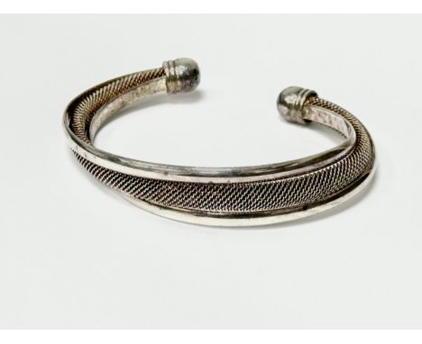 A silver mesh cuff bangle. 30.40g.