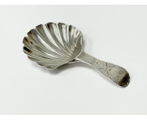 A William IV silver tea caddy spoon. London, 1835.