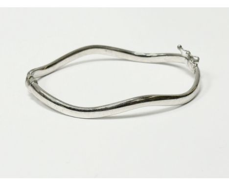 A 9ct white gold bangle. 4.85g