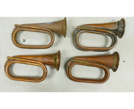 Four Vintage Copper Bugles, length of largest 27cm(4) 