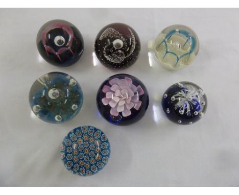 Seven paperweights of various design to include Caithness
