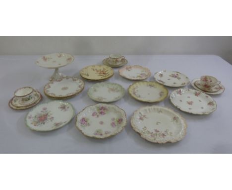 A quantity of Limoges porcelain to include plates, cups, saucers and a cake stand