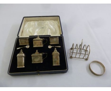 A quantity of silver to include a cased Mappin and Webb condiment set, a toast rack and a silver bangle