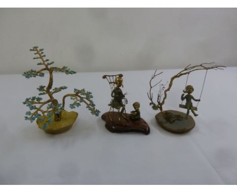 Two Malcolm Moran 1972 miniature sculptures of children playing and a turquoise ornamental tree