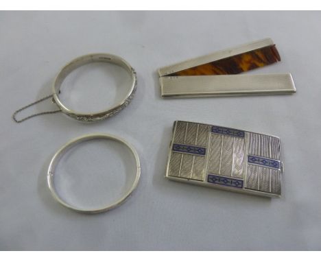 A silver and enamel card case, a silver mounted comb and two silver bangles