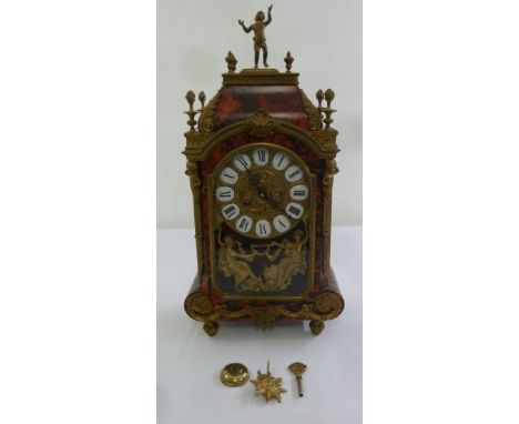 A French Boule and gilt metal mantle clock, gilded dial with Roman numerals on white enamel, to include key and pendulum