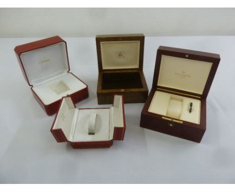 Two Patek Philippe veneered watch boxes and two Cartier watch boxes