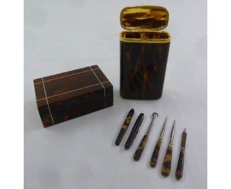 A tortoiseshell rectangular snuff box, a faux tortoiseshell cigarette box with six other items