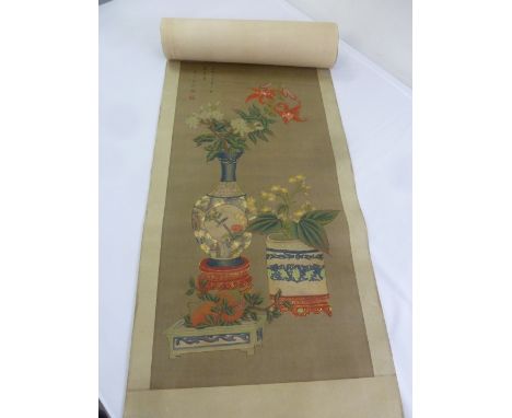 A Chinese scroll painting on silk of flowers in a baluster vase