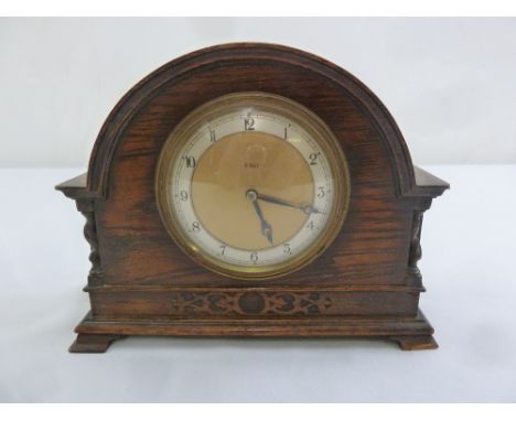 Oak cased 8 day mantle clock, silvered dial, Arabic numerals