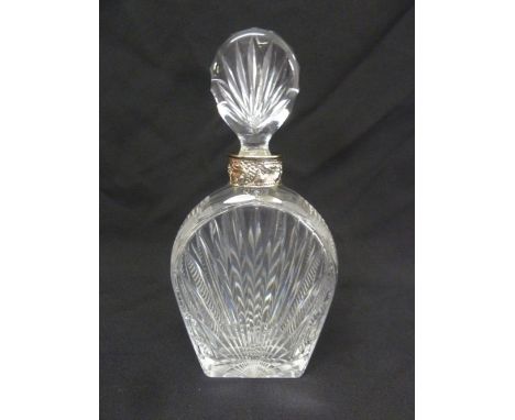 A cut glass shaped oval decanter with white metal collar and drop stopper