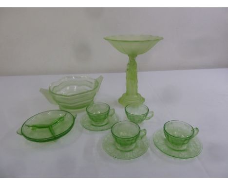 A quantity of Art Deco style green glass to include cups and saucers, a tazza and a fruit bowl (10)