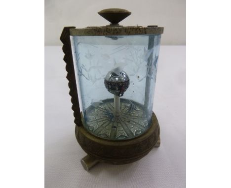 An automaton desk clock in the form of an aquarium with etched glass and metal base and mounts