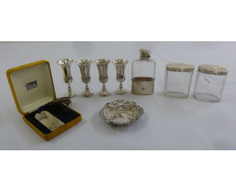 A quantity of silver to include four Kiddush cups, a hip flask, two dressing table jars with silver covers, a bonbon dish and