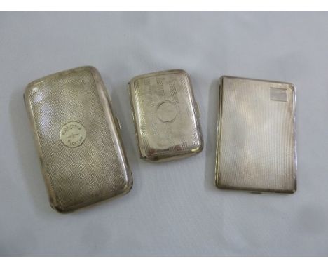 Three engine turned hallmarked silver cigarette cases