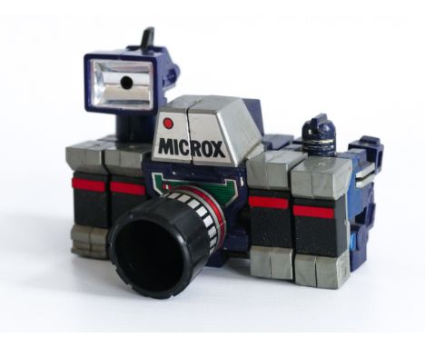 This is a vintage MICROX transforming camera robot made in JAPAN by TAKARA in the 1980's. Good played with condition. This wo
