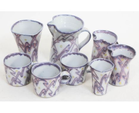Janice Tchalenko "Jazz" for Dartington Pottery, eight pieces comprising three mugs, two vases and three jugs, heights ranging