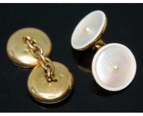 A pair of mother of pearl and cultured pearl set cufflinks, marked '18', gross wt. 8.01g, with fitted case.  Condition - one 