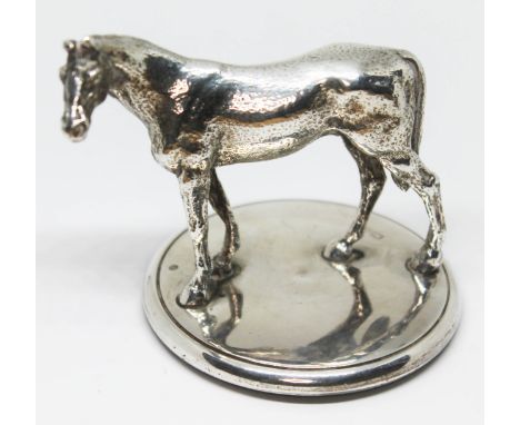 A horse finial probably an entree dish handle, the base marked with lion passant, date letter 'L', horse unmarked, gross wt. 