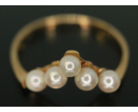 A cultured pearl wishbone ring, marked 'K18', gross wt. 1.44g, size L.  