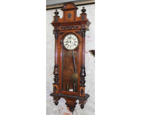 A late 19th century walnut cased double weight driven Vienna wall clock, length 135cm.Condition: Clock remains untested and w