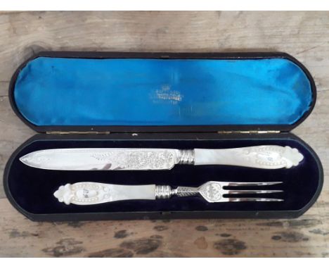 A cased silver knife and fork with mother of pearl handles, Chawner &amp; Co, London 1876. 