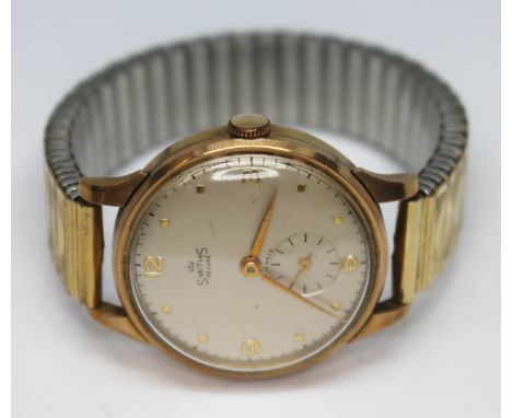 A 1950s Smiths De Luxe hallmarked 9ct gold wristwatch with champagne signed dial, Arabic numerals, hour dots and hands in gol