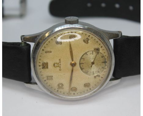 A 1947 stainless steel Omega 13322, with signed tropical dial, Arabic numerals and hands in gold and seconds subsidiary dial 