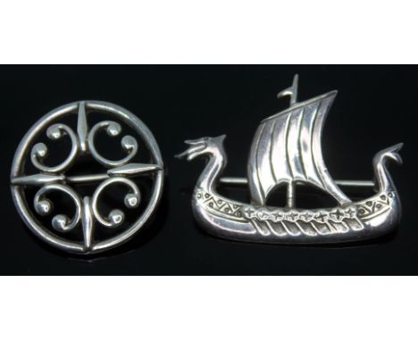 Two modern Scottish Celtic style silver brooches by Ola M Gorie, one fromed as a Viking ship, length 37mm and the other as a 