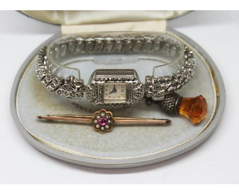 A mixed lot comprising a vintage ladies wristwatch, a brooch marked '9ct' wt.2.46g and a button hook with thistle finial.  