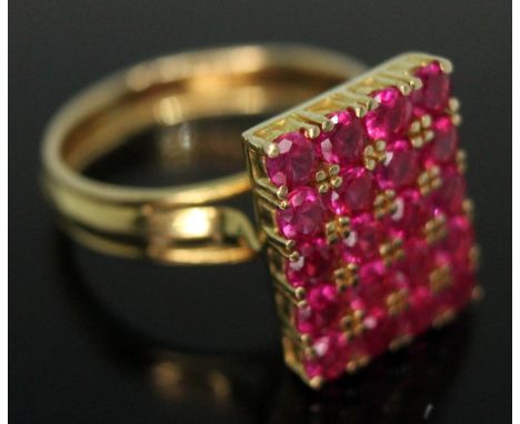 A yellow metal and synthetic pave set ruby ring, indistinctly marked, gross wt. 7.60g, size  
