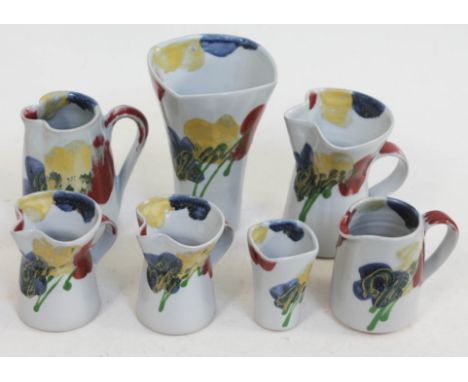 Janice Tchalenko "Poppy" for Dartington Pottery, a group of seven pieces comprising five jugs and two vases, heights ranging 