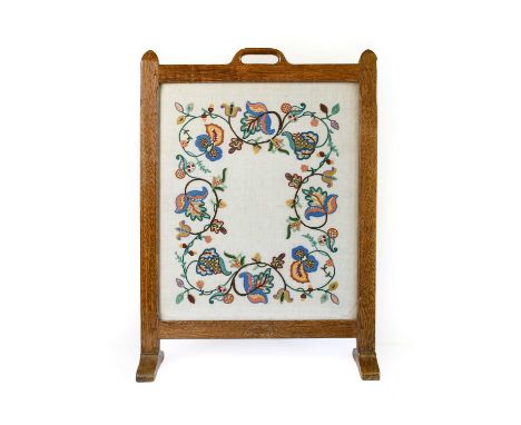 Oakleafman: Fred Suffield (Thirsk): An English Oak Firescreen, aperture handle, the frame inset with an embroidered panel, on
