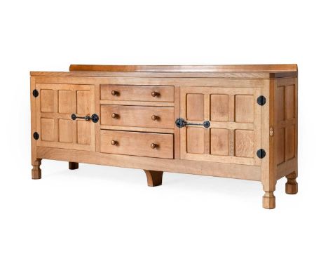 Workshop of Robert Mouseman Thompson (Kilburn): An English Oak 6ft Sideboard, with raised upstand, above two doors enclosing 