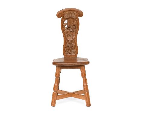 Sidney Pollard (1914-1994) of Thirsk: An English Oak Spinning Chair, the shaped back carved with a panel depicting a young wo