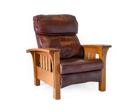 A Modern Arts & Crafts Stickley Morris Oak Reclining Bow Armchair, with mahogany leather upholstered seat, bustle back cushio