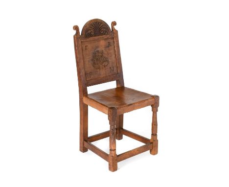 Robert Mouseman Thompson (1876-1955): An English Oak Panel Back Chair, carved top rail and uprights, the back carved with a g