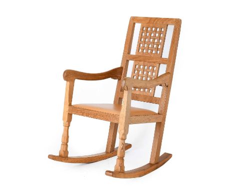 Workshop of Robert Mouseman Thompson (Kilburn): An English Oak Rocking Chair, 1993, with two lattice panel backs, shaped arms