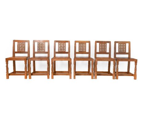 Workshop of Robert Mouseman Thompson (Kilburn): A Set of Six English Oak Lattice Back Dining Chairs, tan hide upholstered sea