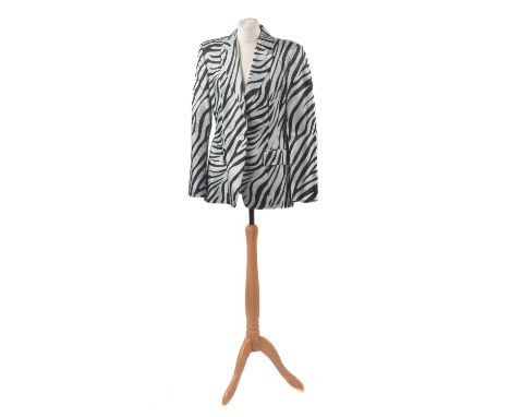 A silk blazer by Gucci, the silk zebra print blazer with mother of pearl buttons, size 48.Condition report: Overall condition